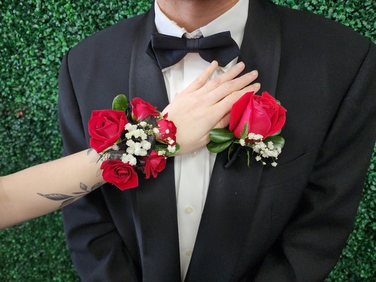 WC102 Red Spray Rose Wrist Corsage and Boutonniere from Fabbrini's Flowers in Hoffman Estates, IL