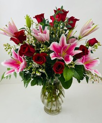 Dozen red roses with stargazer lilies V101 from Fabbrini's Flowers in Hoffman Estates, IL
