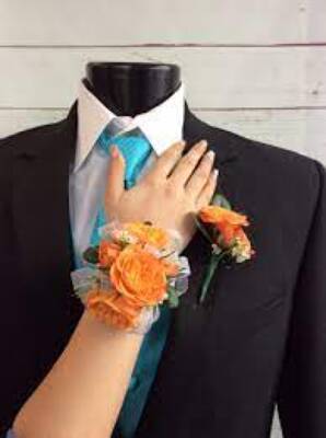 WC112 Orange Spray Rose Wrist Corsage and Boutonniere from Fabbrini's Flowers in Hoffman Estates, IL
