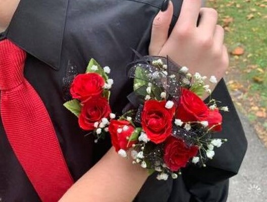 WC102 Red Spray Rose Wrist Corsage and Boutonniere from Fabbrini's Flowers in Hoffman Estates, IL